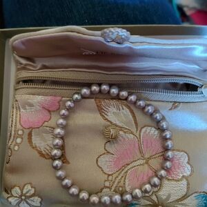 Elegant Floral Satin Clutch with Pearl Bracelet